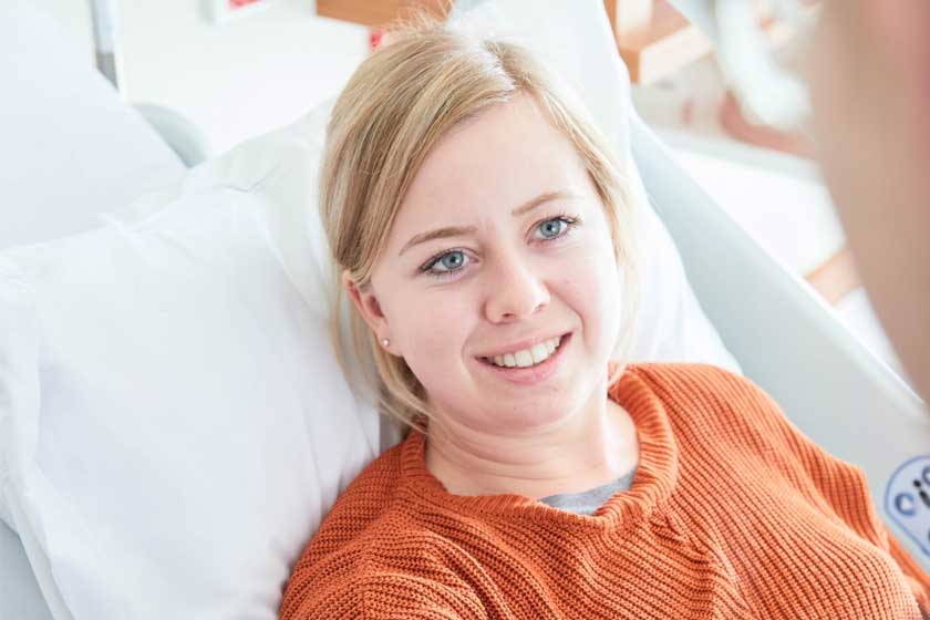 Reception caregiver welcoming patient