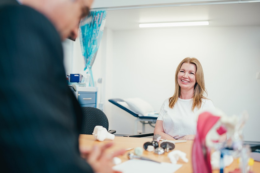 Self-funded patient talking with specialist in consulting room