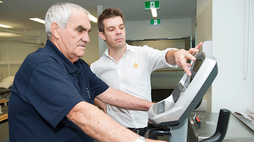 Caregiver with patient in rehabilitation