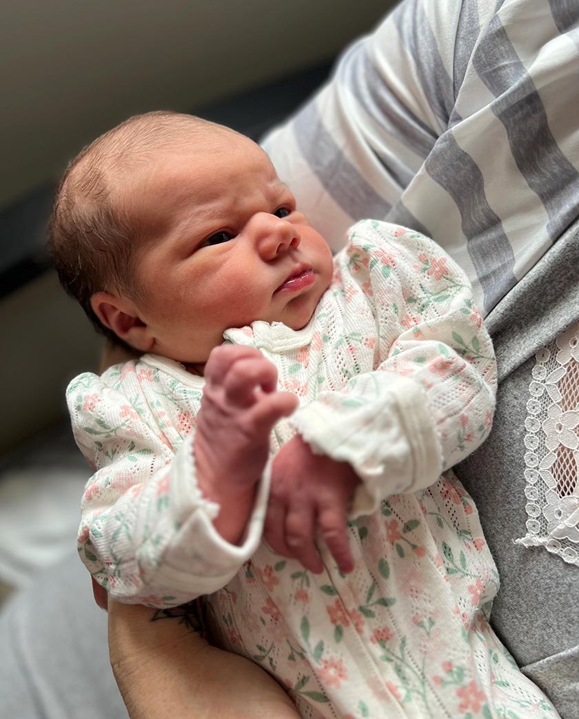 Close up of baby Harper staring up at Mum.