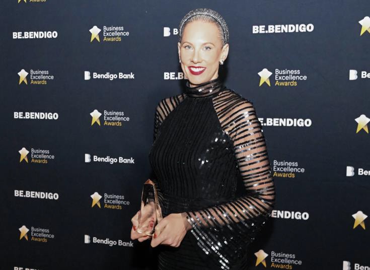 Anna Hill, Director of Marketing and Business Development, with her award.