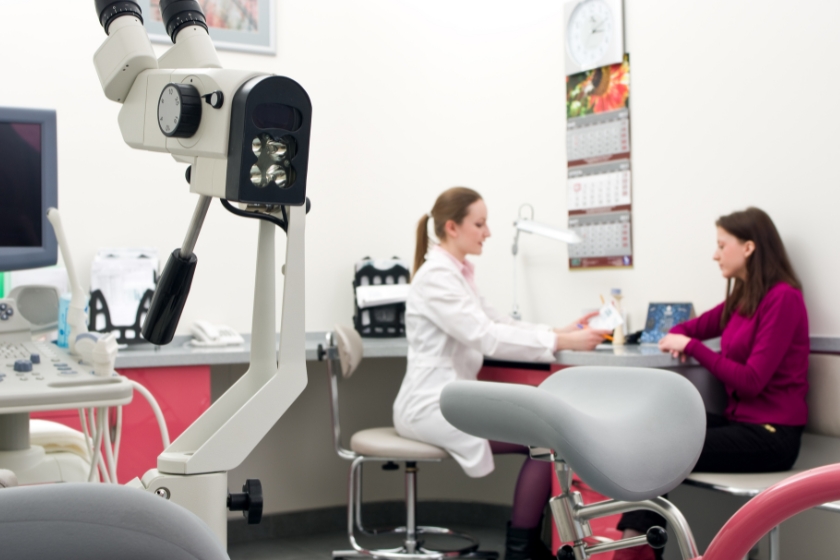 A doctor talking to a patient inside a hospital