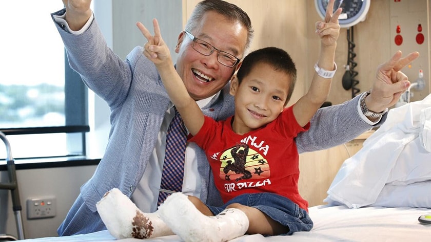 Professor Ton Tran with Chien after surgery