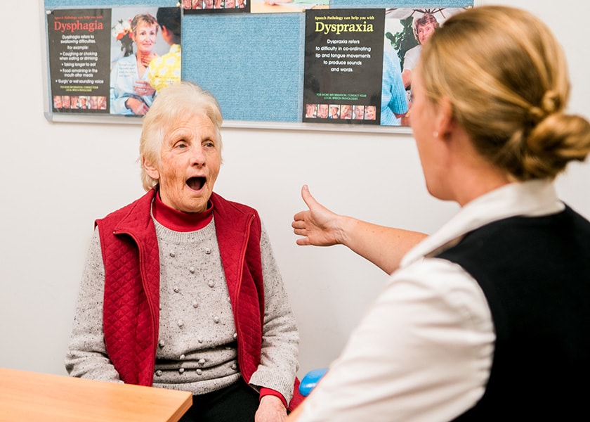 St John of God Frankston caregiver treating Parkinsons patient