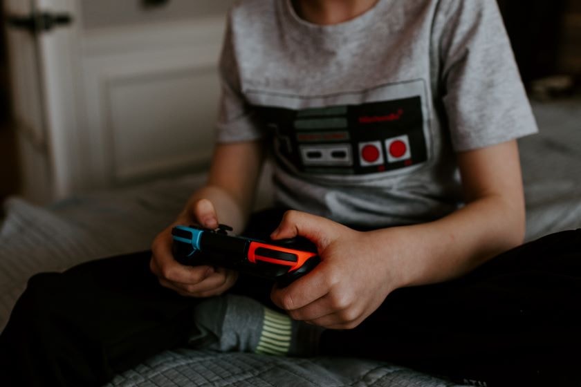 Child holding gaming console