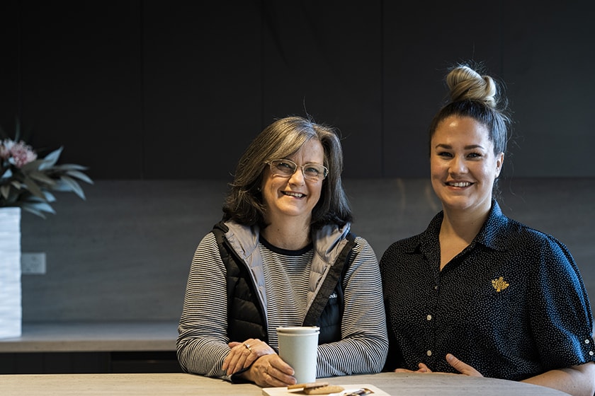 Caregiver and patient with a coffee