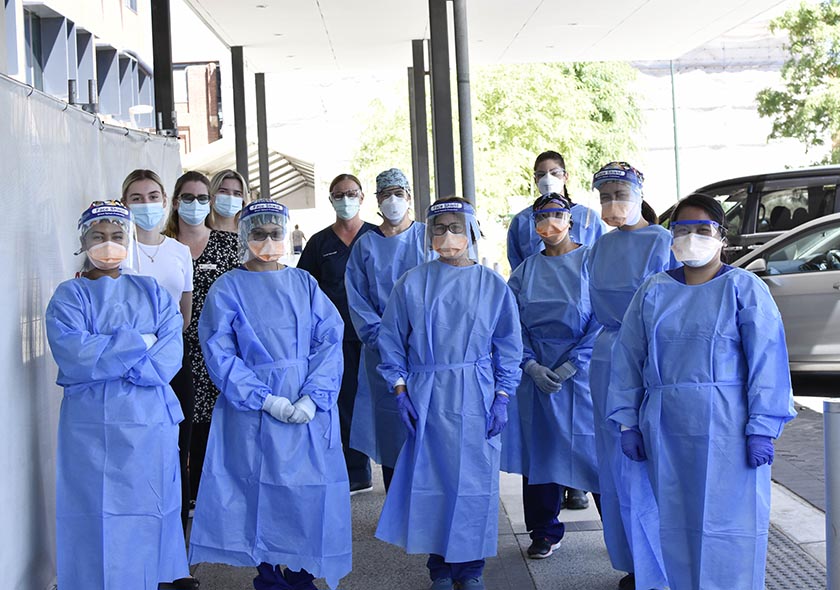 St John of God Midland Public and Private Hospitals COVID-19 Clinic team outside of hospital wearing full PPE