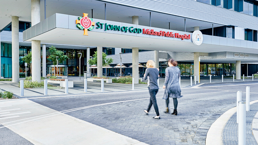 Visitors walking into hospital