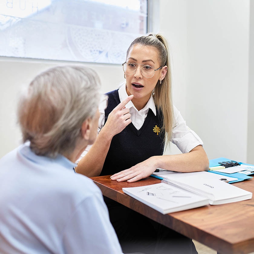 Image of speech pathologist speaking to patient 