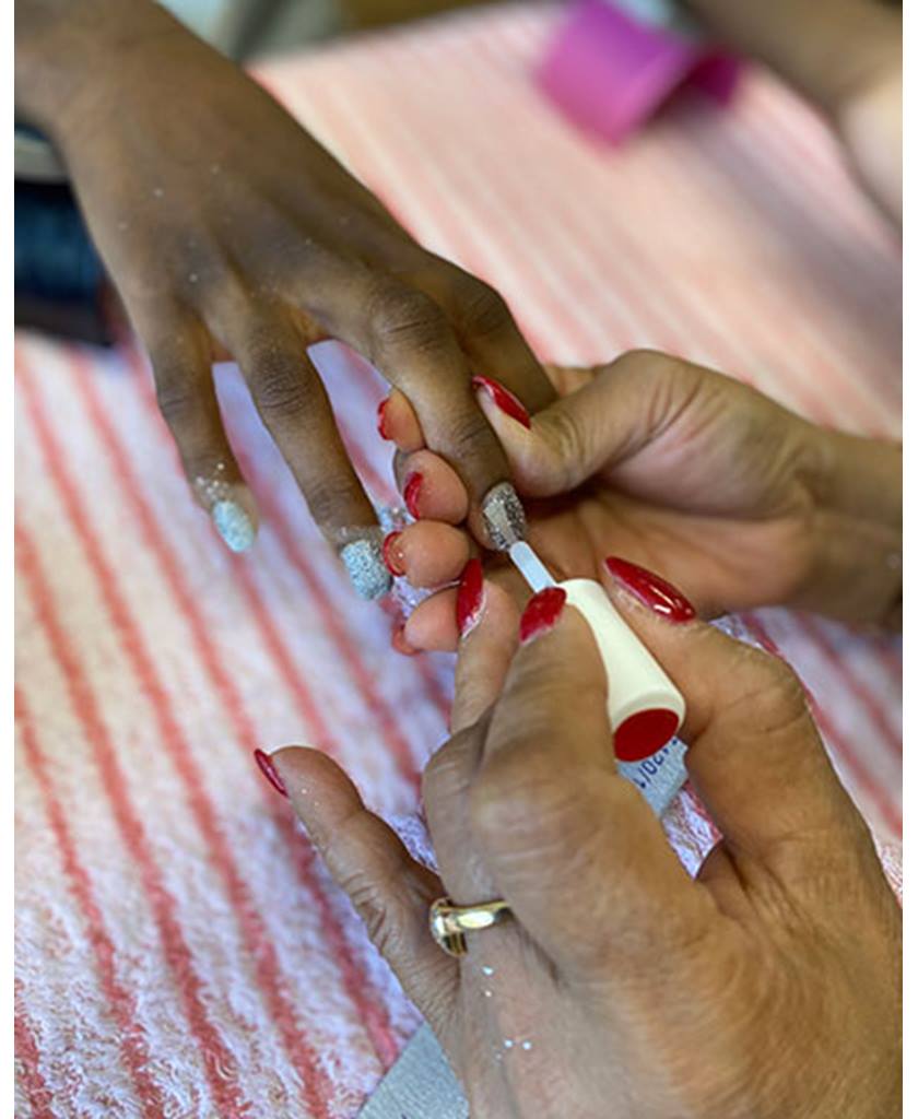 Person getting their nails painted