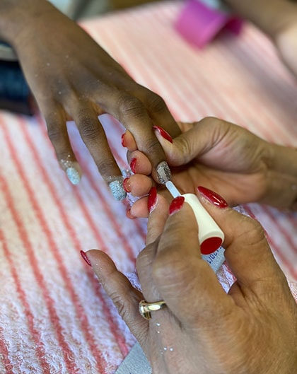Person getting their nails painted