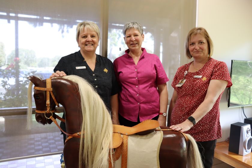 St John of God Murdoch Community Hospice have had two wooden rocking horses donated by Renate Haubner (middle)