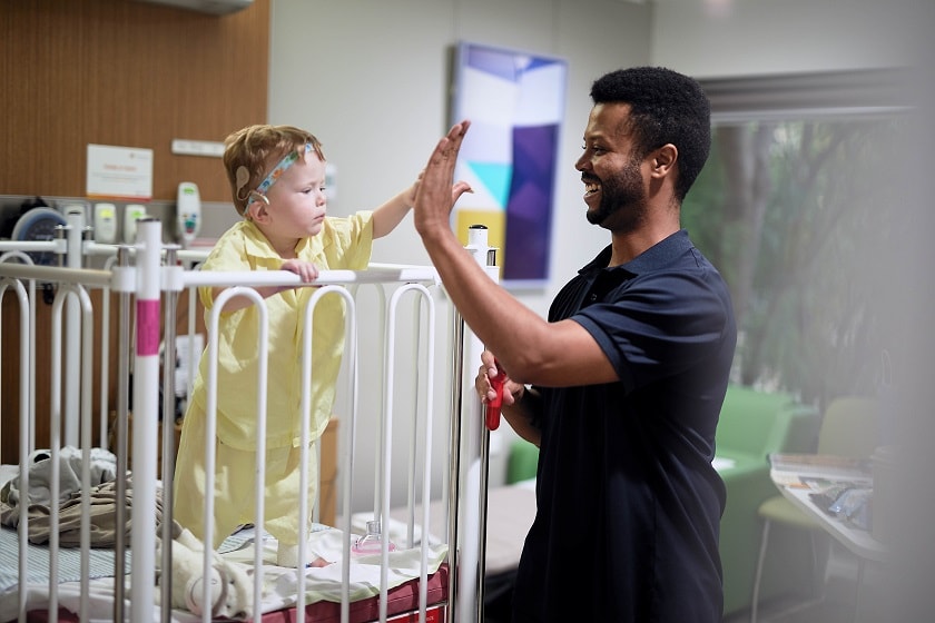 paediatric surgery, young child playing with paediatric nurse 