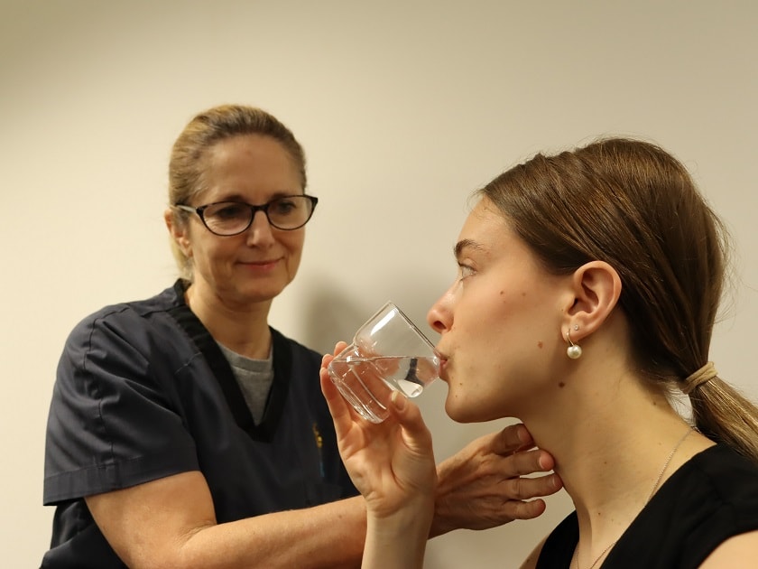 St John of God Murdoch Hospital Senior Speech Pathologist Leanne Chidgzey with a patient during an assessment