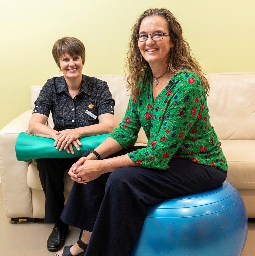 Liza Fowler on exercise ball in birthing suite