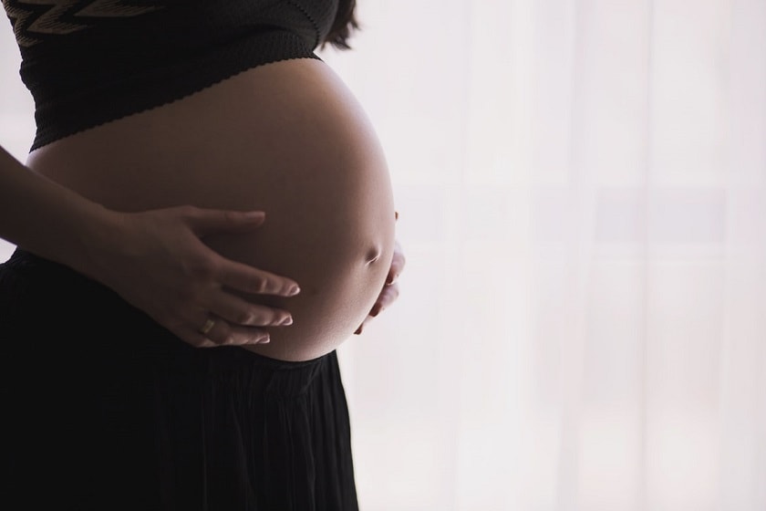 Maternity patient holding stomach
