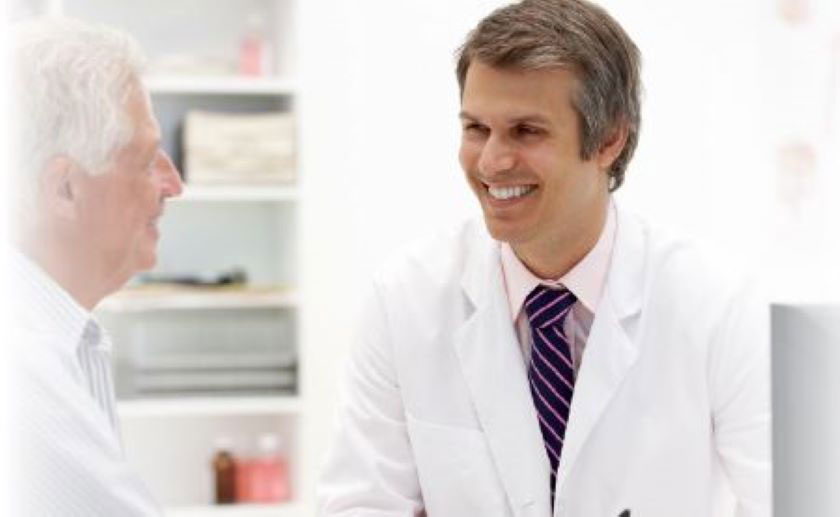 Doctor smiles at elderly patient