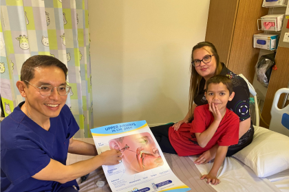 Associate Professor George Sim with Jahkye Harris (a recipient of surgery through Djaalinj Waakinj) and mum, Nikki Naylor.