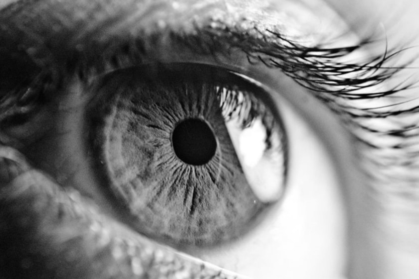 zooned in shot of the iris of an eye in black and white