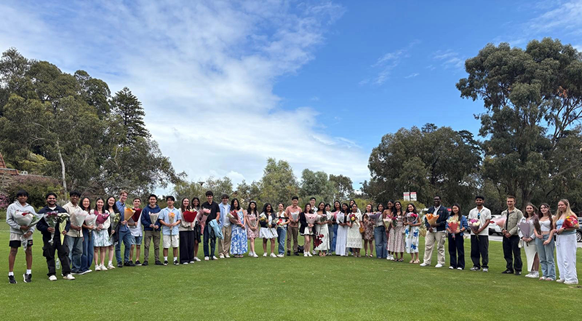 Group shot of people standing in a circle