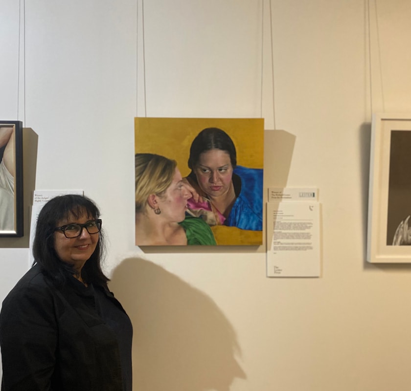 St John of God Subiaco Hospital art curator Connie Petrillo with the 2020 Lester Prize winning portrait, The Conversation, by Serena Cowie