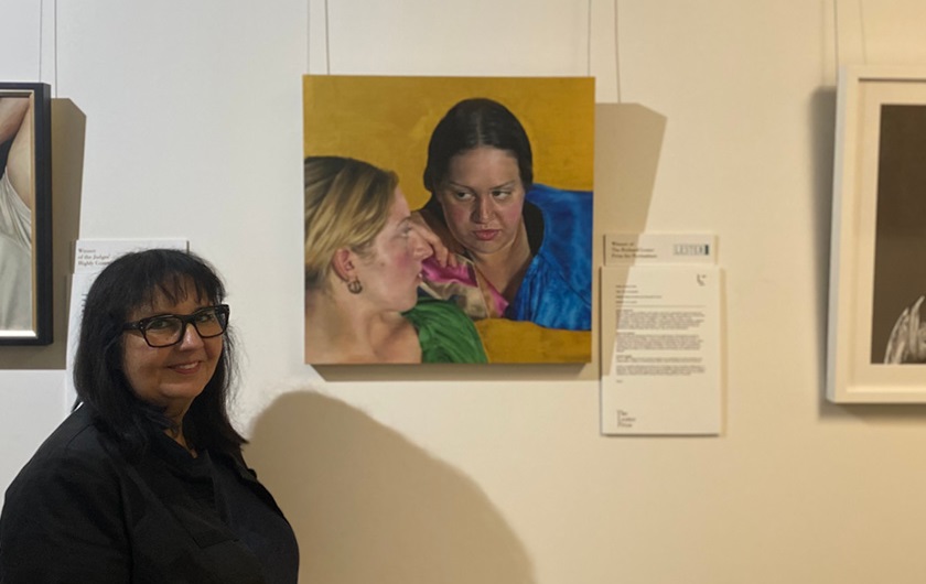 St John of God Subiaco Hospital art curator Connie Petrillo with the 2020 Lester Prize winning portrait, The Conversation, by Serena Cowie