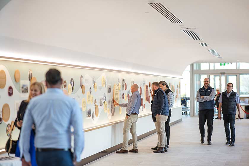 People look at the artwork in a newly refurbished St John of God Ballarat Hospital hallway