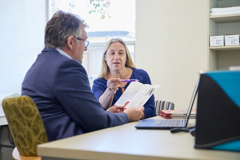 Doctor explaining to patient what it means to be a no-gap provider