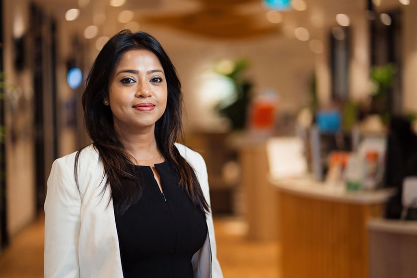 Profile photo of Debolina looking at camera wearing white jacket