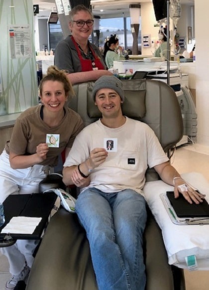 Oncology patient showing his artwork made during art therapy