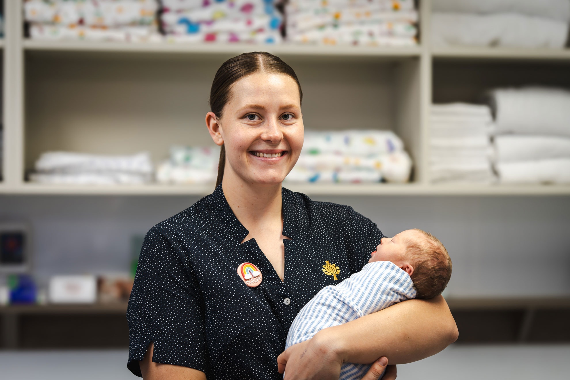 Morgan Keating pictured holding a newborn baby