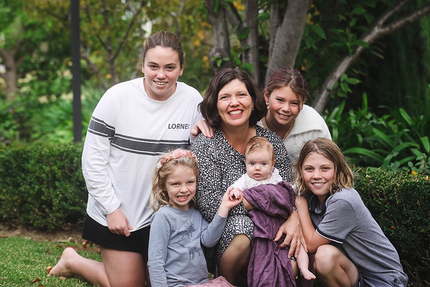St John of God Geelong Hospital’s Director of Medicine Dr Georgina Hayden with family outside in a garden setting