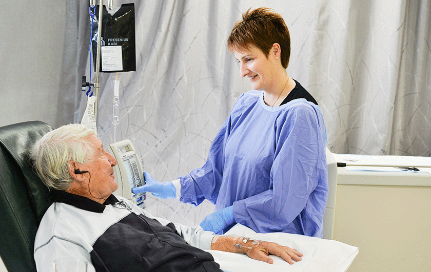 Nurse checks on a day chemotherapy patient