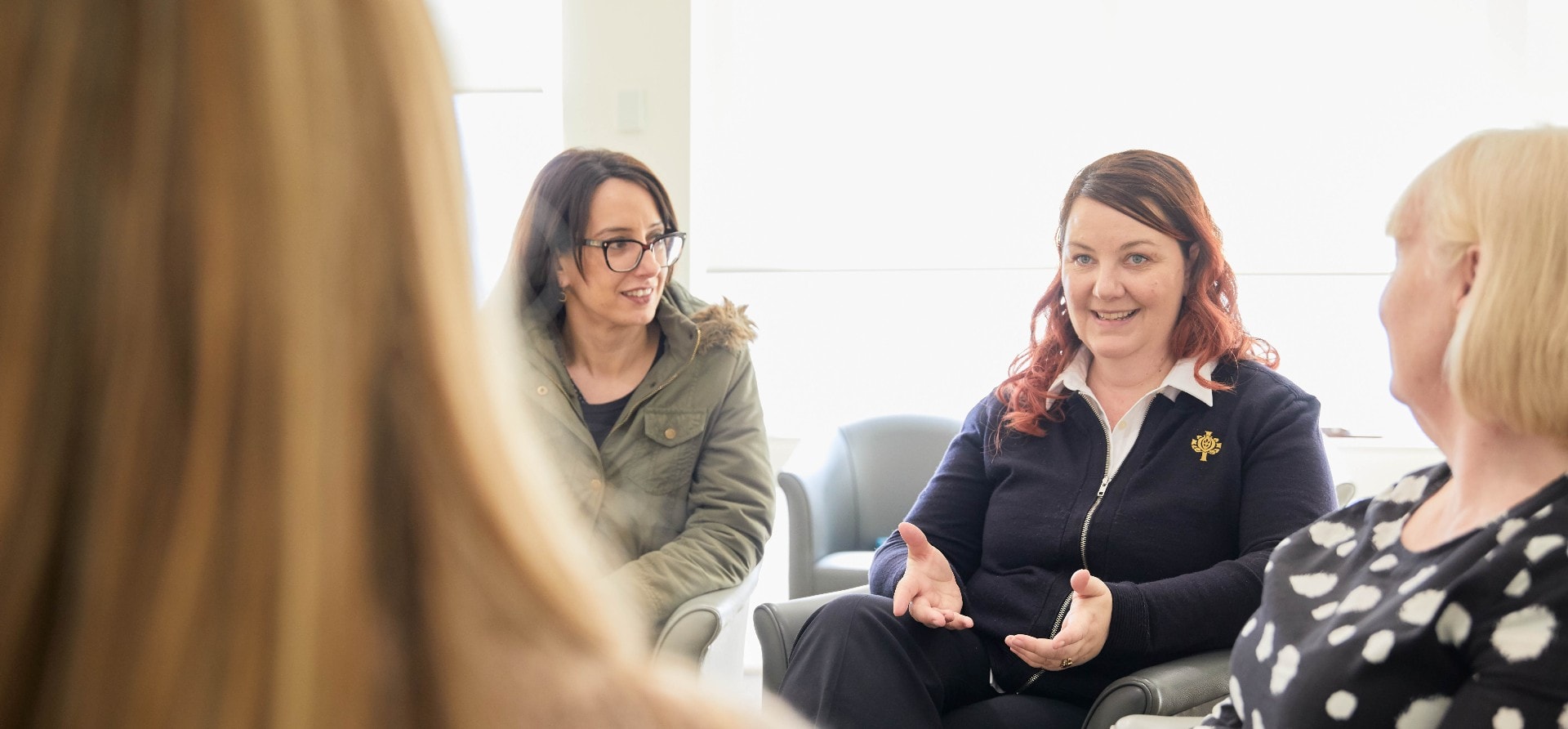 Women talking in a mental health therapy group
