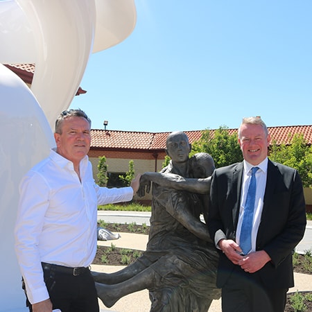 Artist Dr John Tarry with St John of God Murdoch Hospital Chief Executive Officer John Fogarty standing in front of the Elevacion artwork