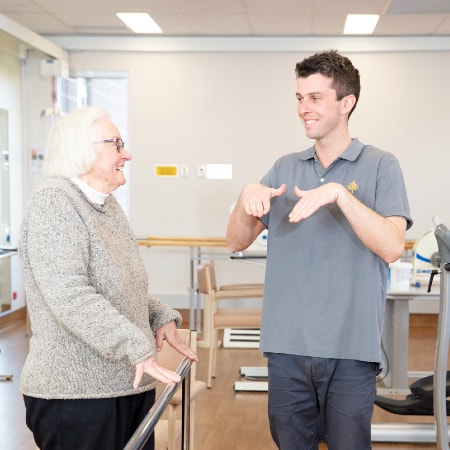 Allied health worker instructing patient