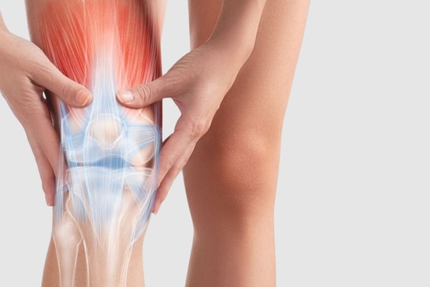 A man holding his knee