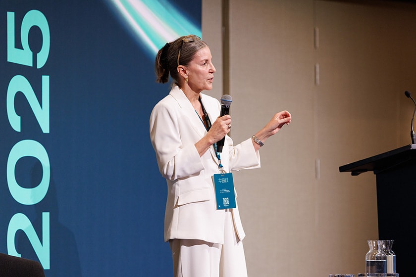 Project Lead Leanne Lind addresses the audience on stage