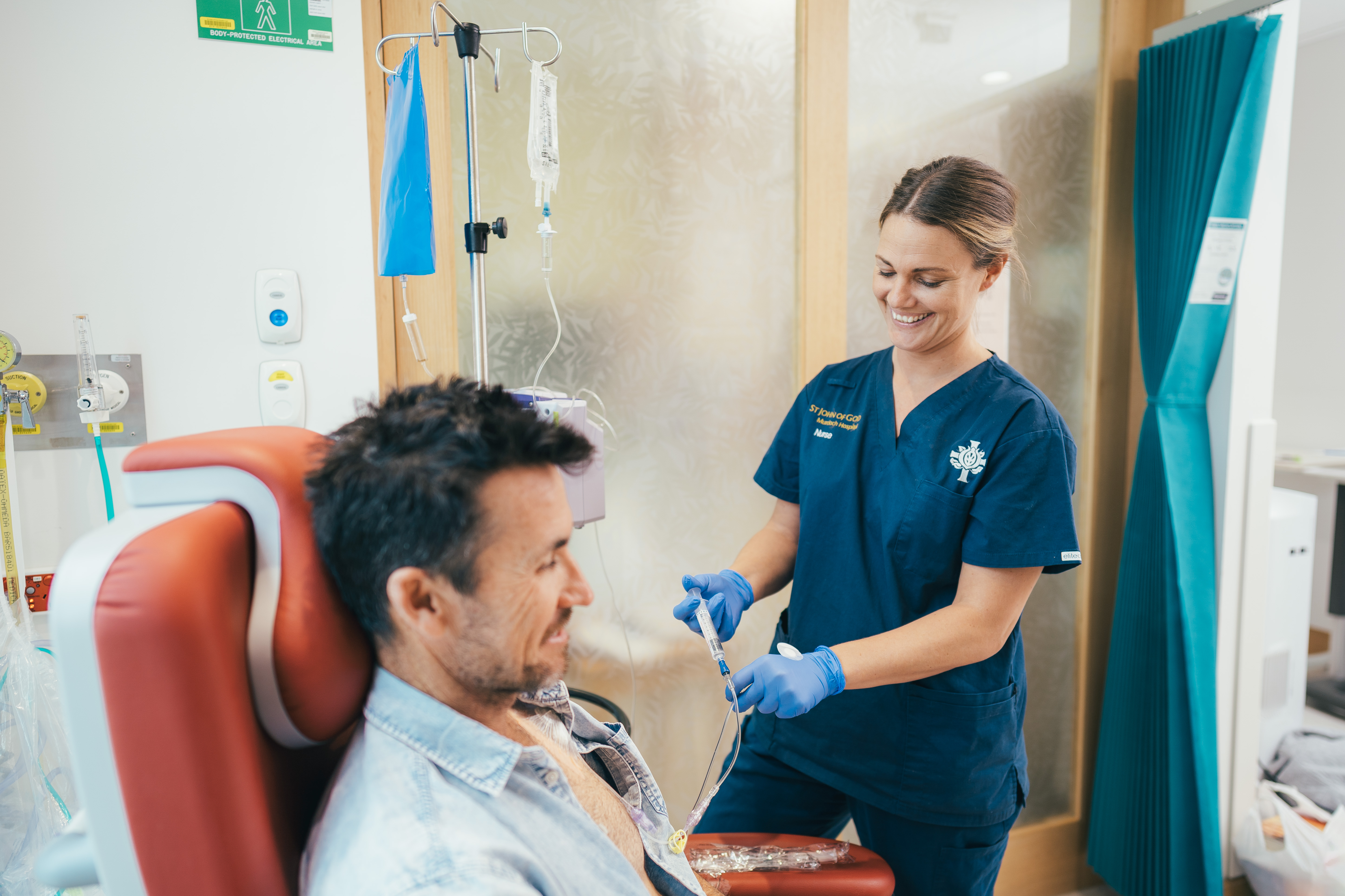 A caregiver looking at cancer patient 