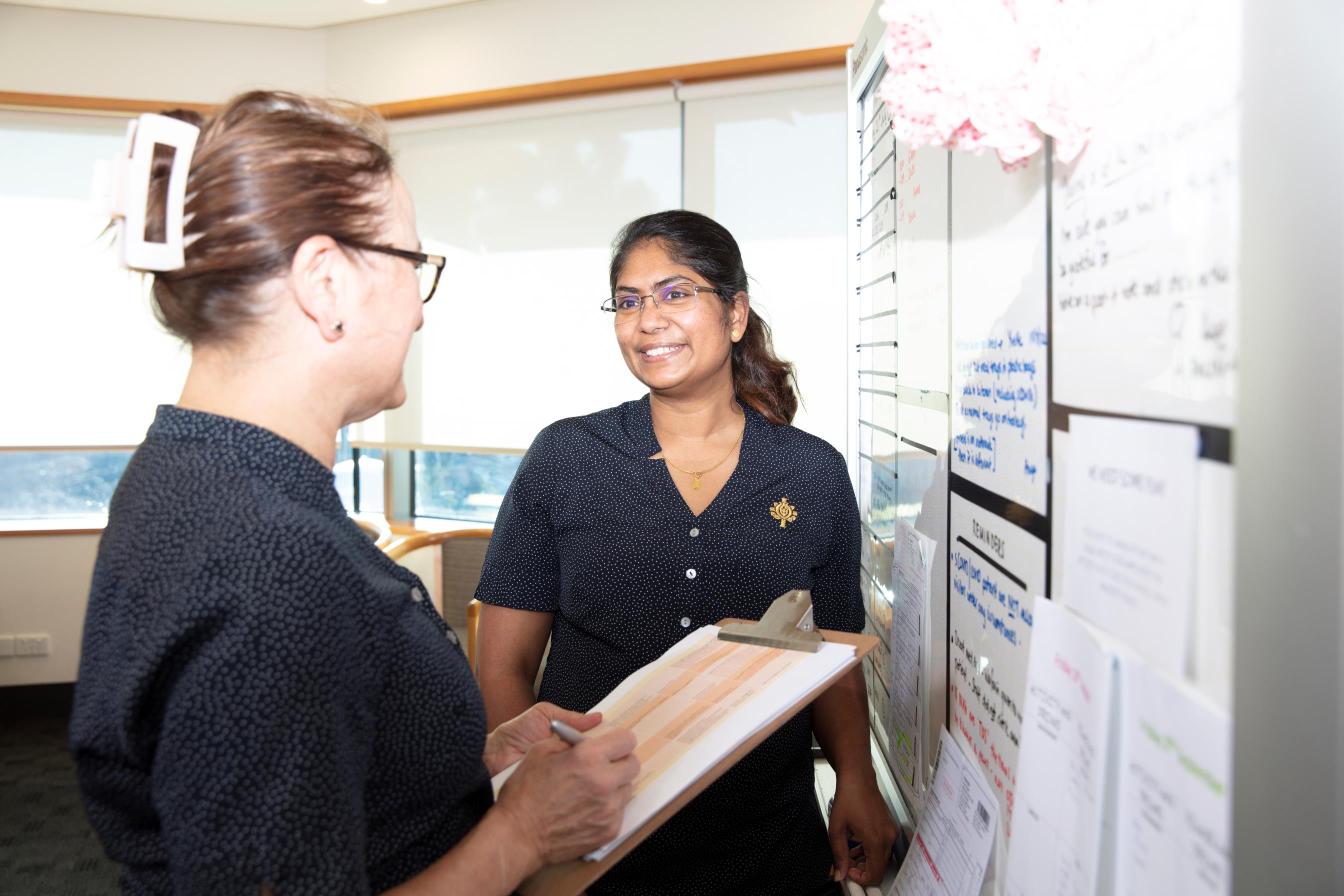 Two caregivers discussion a patient case.jpg
