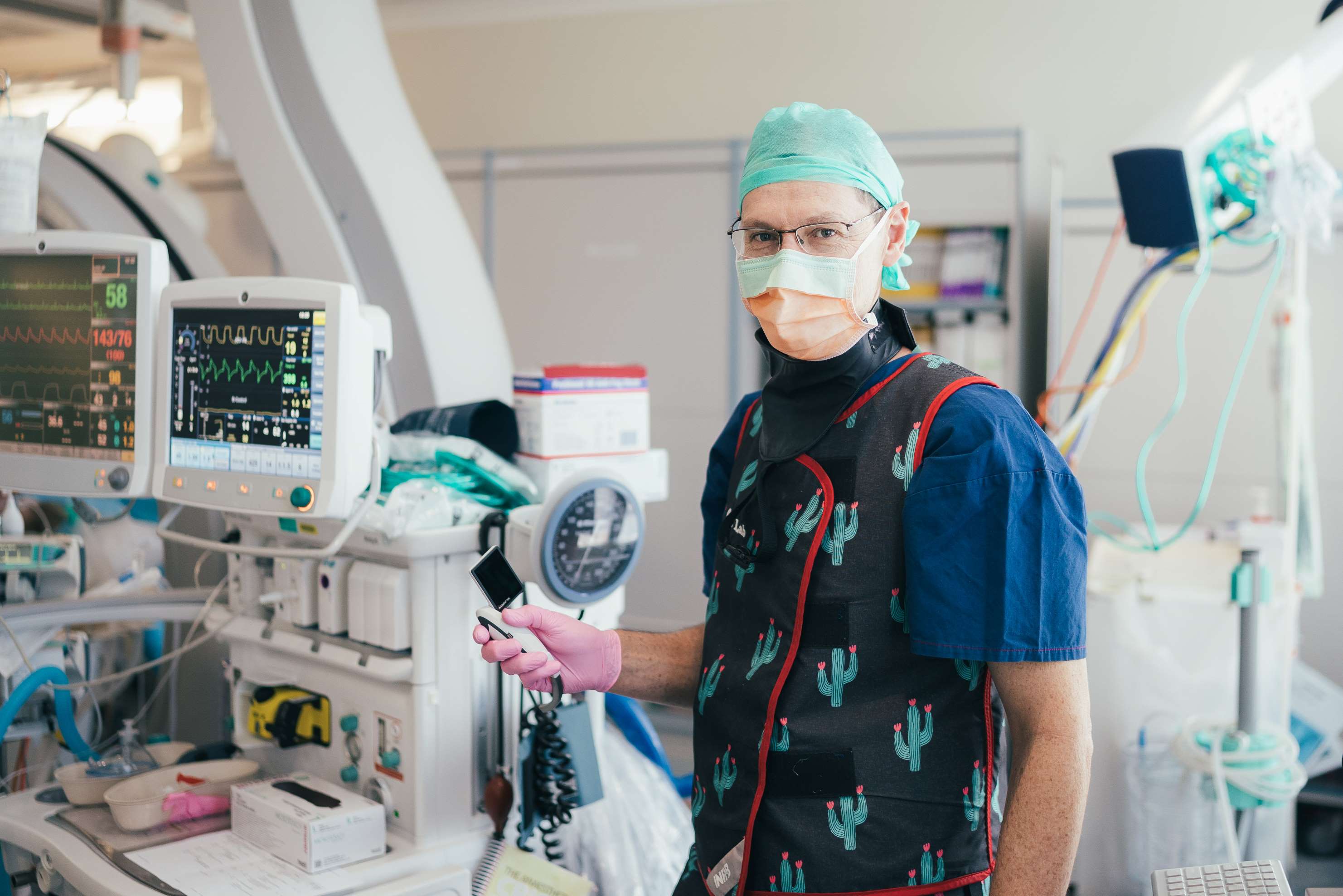 Surgeon in operating room in full protective wear