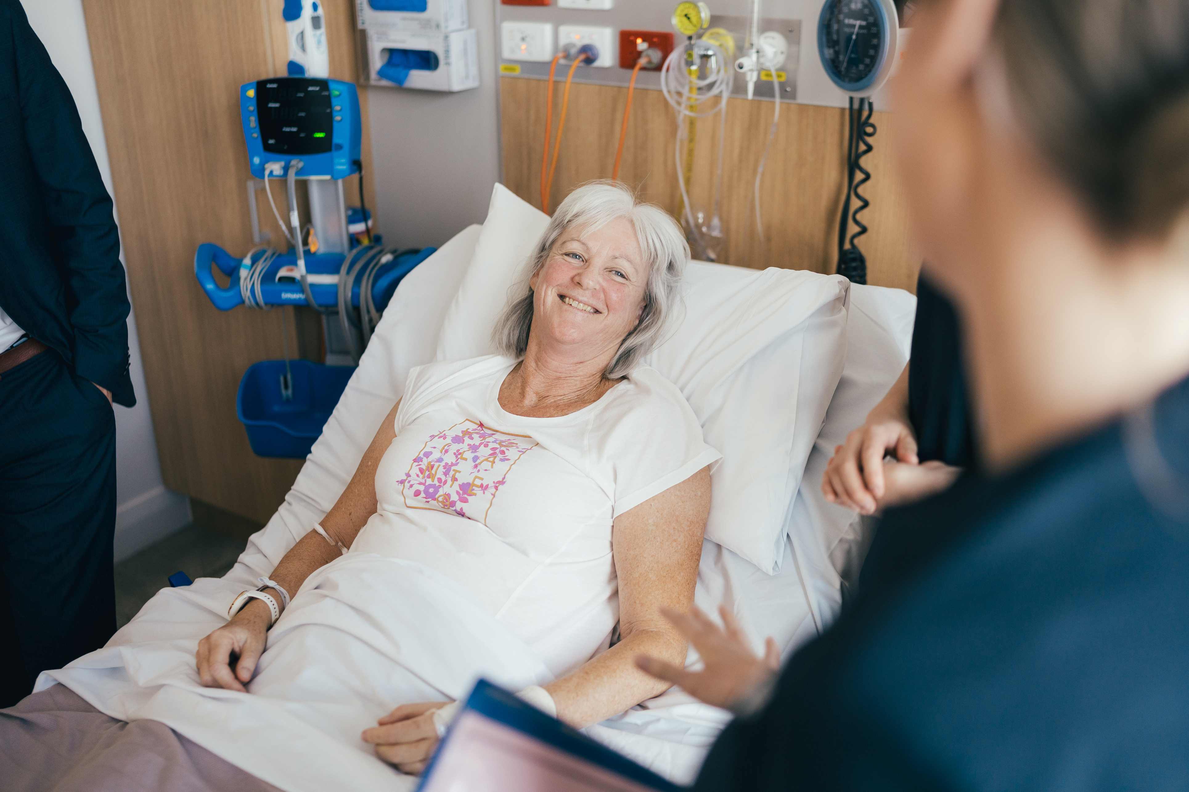 A caregiver comforts a breast cancer patient 