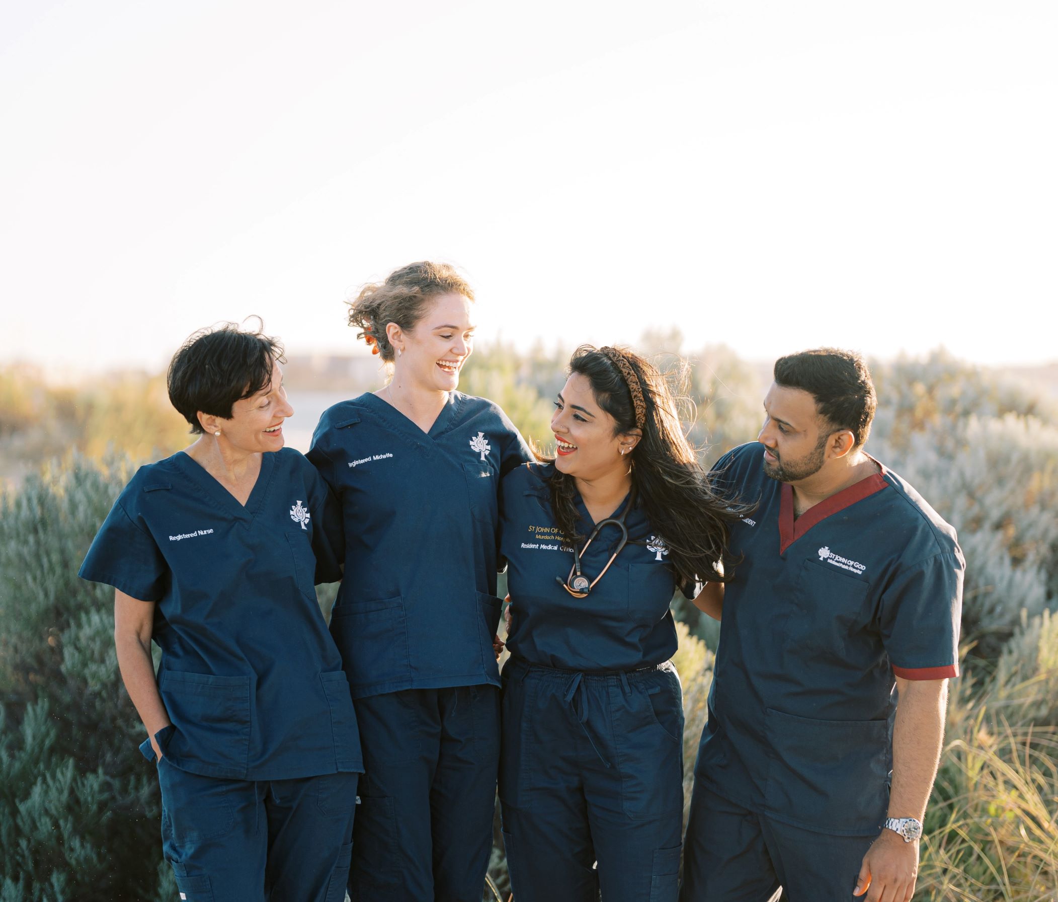 Nurses looking at each other at the beach 