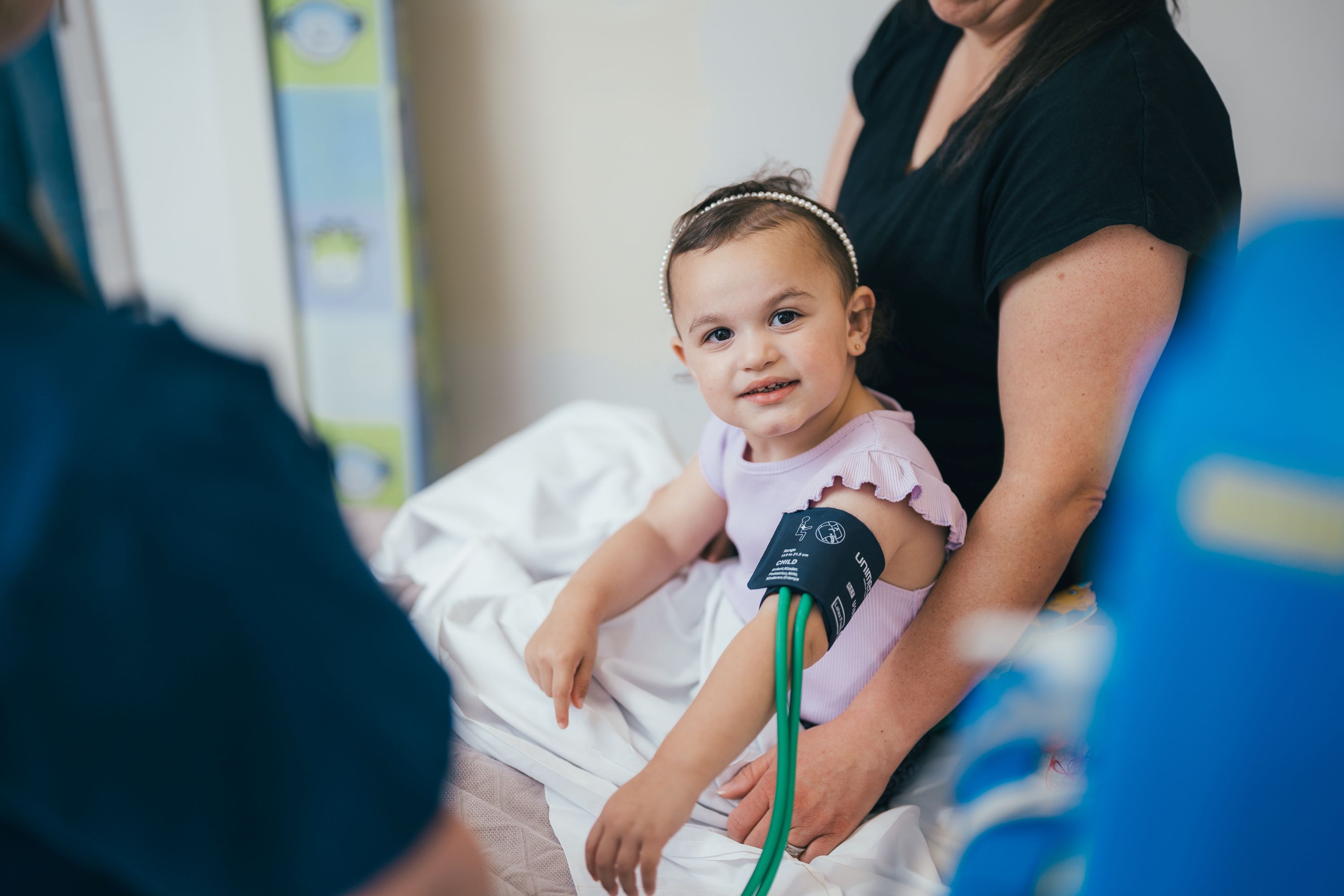 Young girl having her blood pressure taken