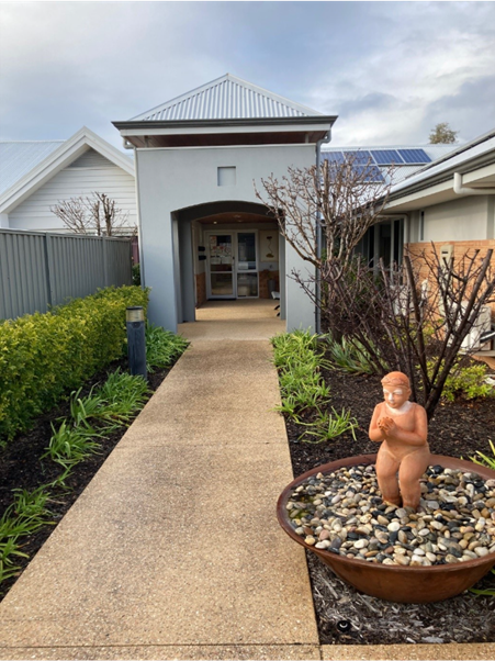 ain entrance to Cancer Accommodation services shows garden path and gardens 
