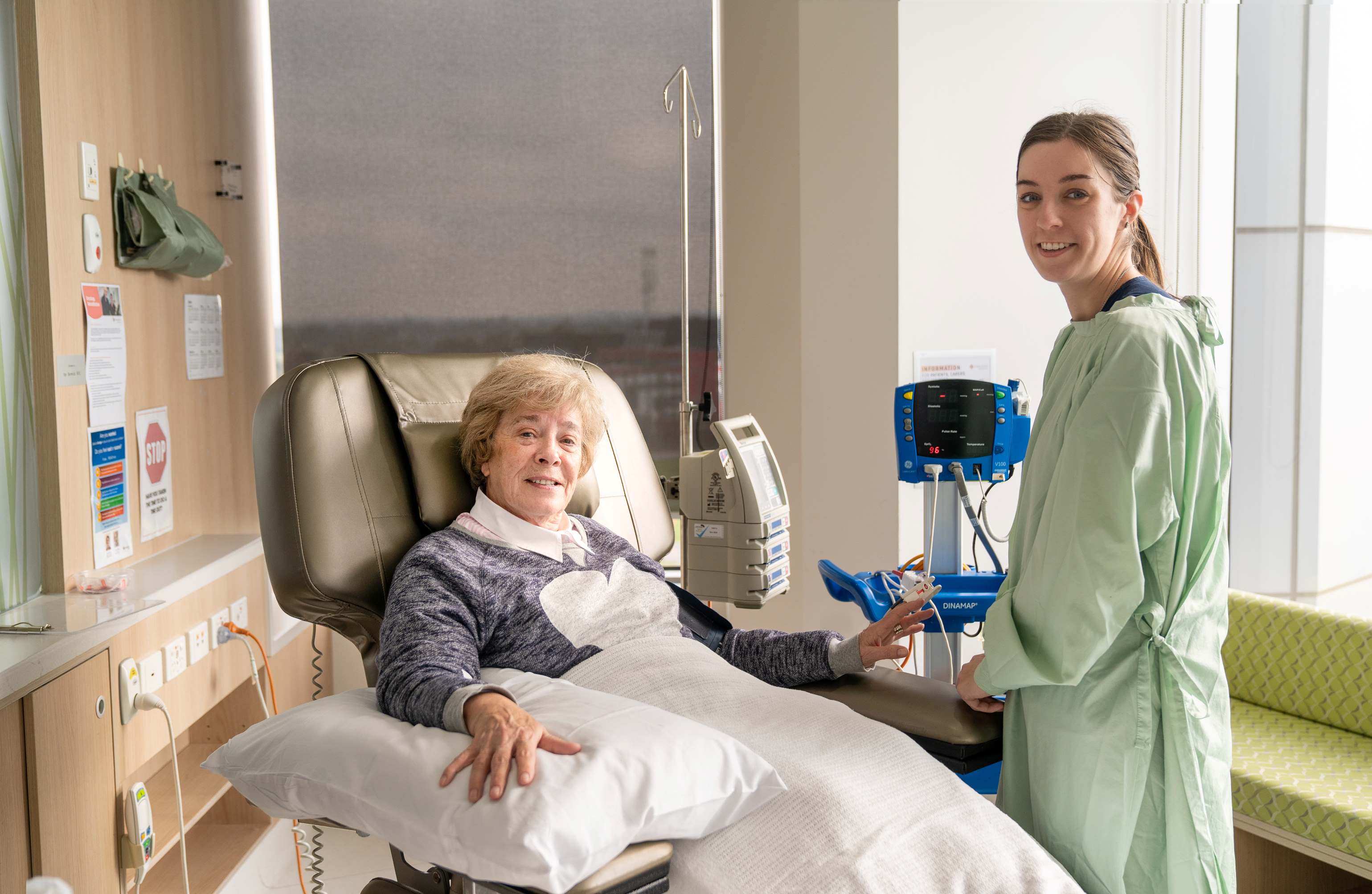 Caregiver taking patient's vitals
