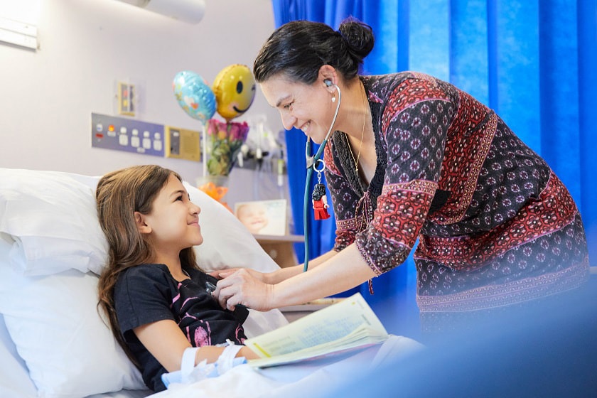 Paediatrician with young child