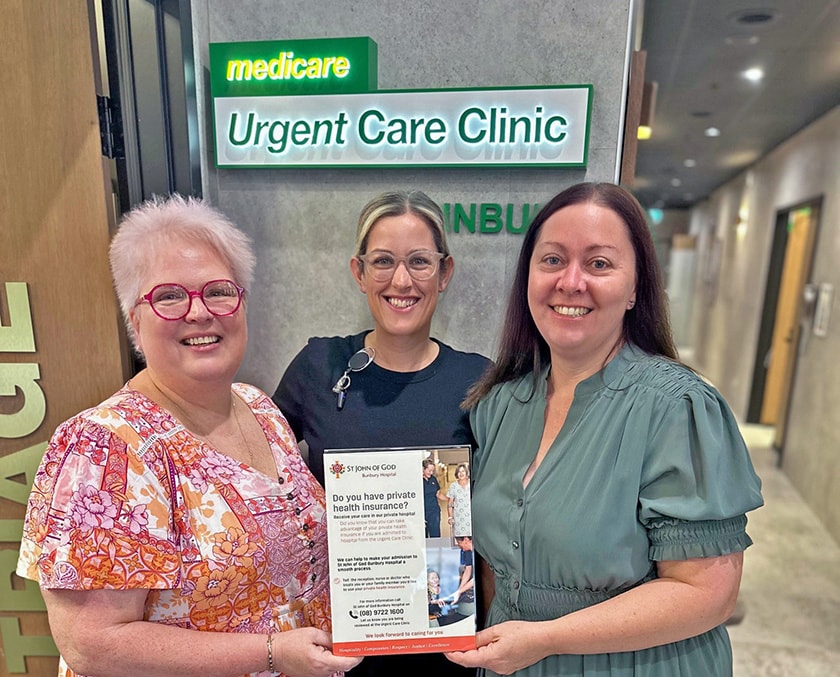 Dr Michele Genevieve, Nicole Scott and Ami Thomas hold up brochure collateral in front of the Urgent Care Clinic