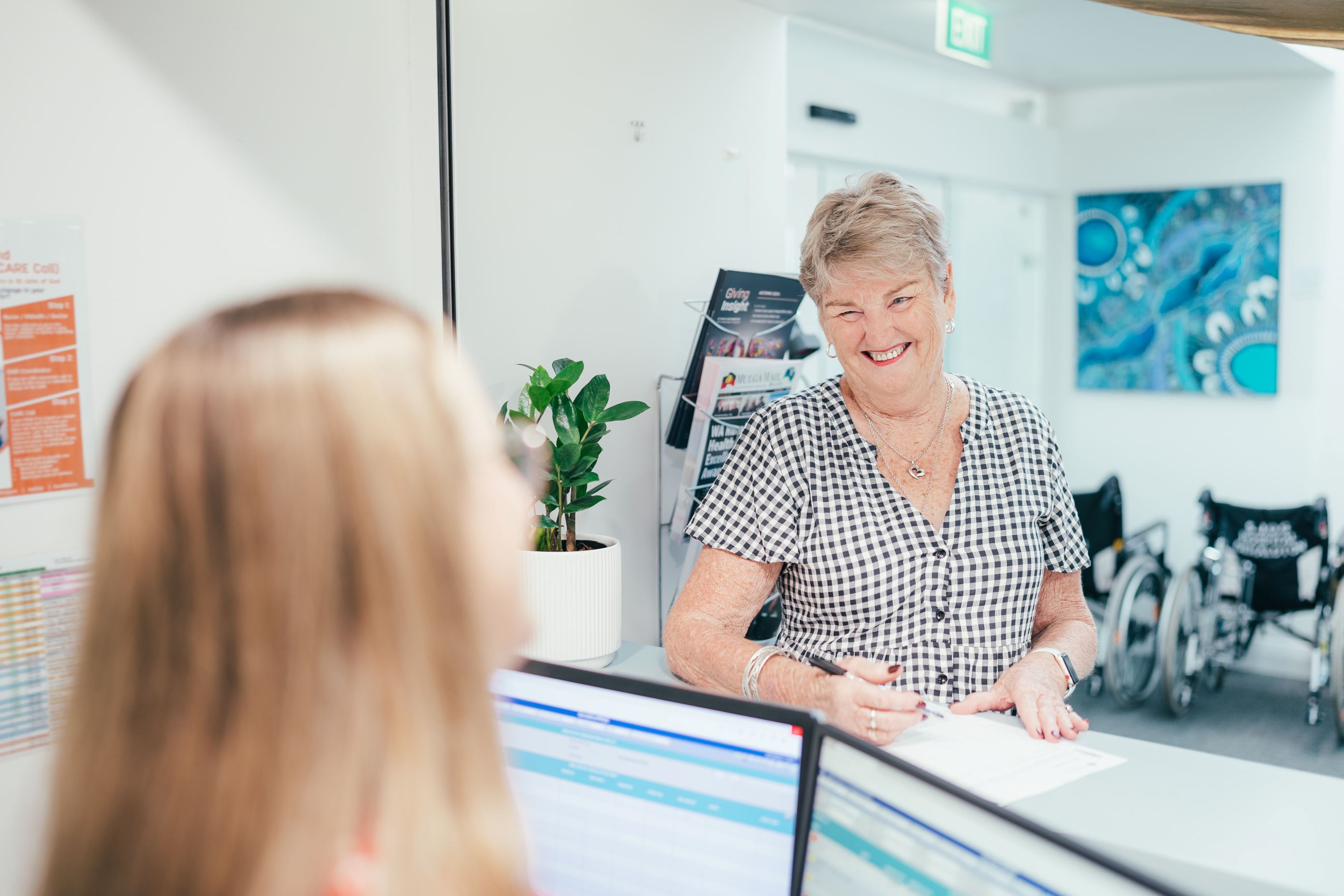 Client speaking with hospital admin caregivers
