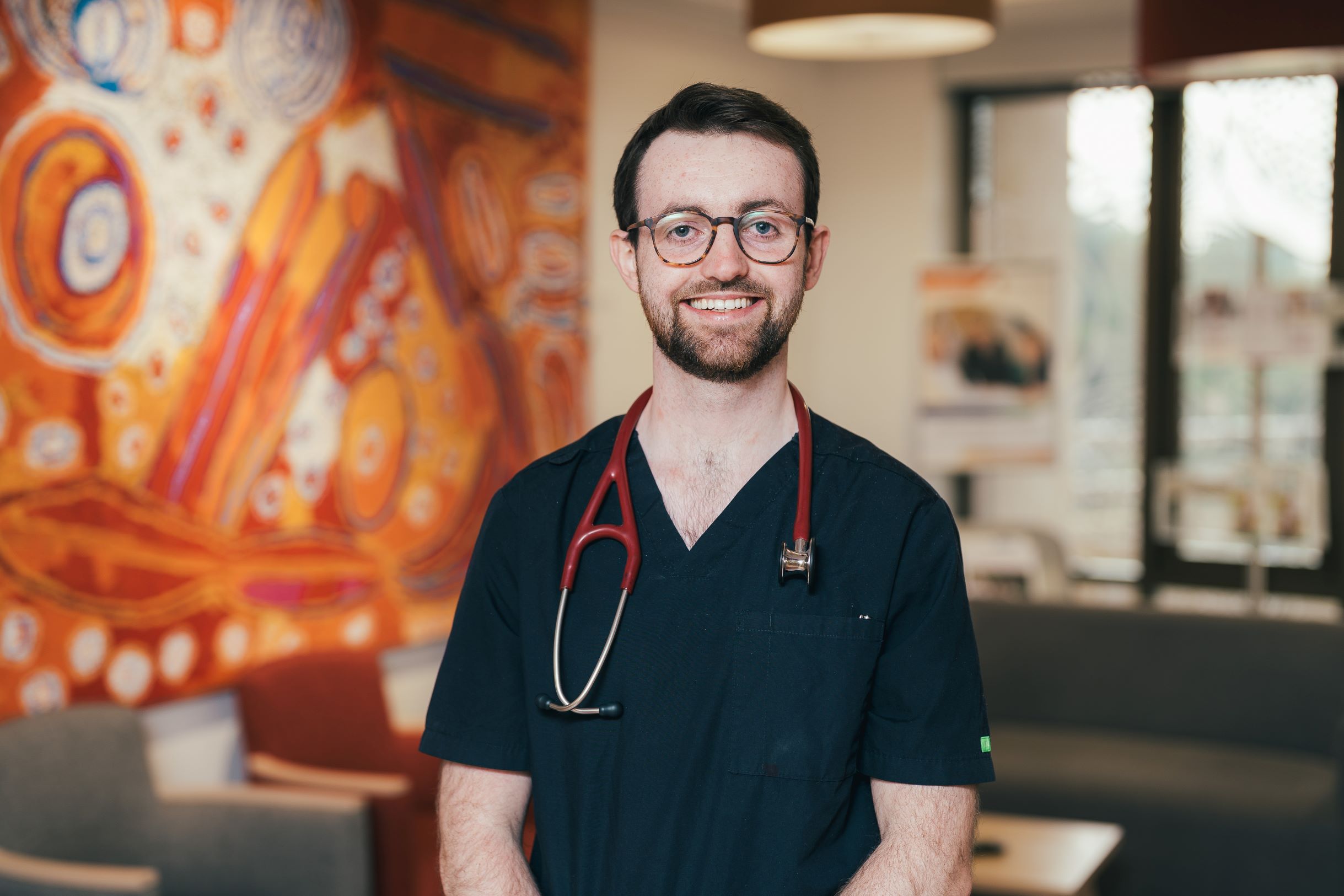 Junior doctor in uniform smiling